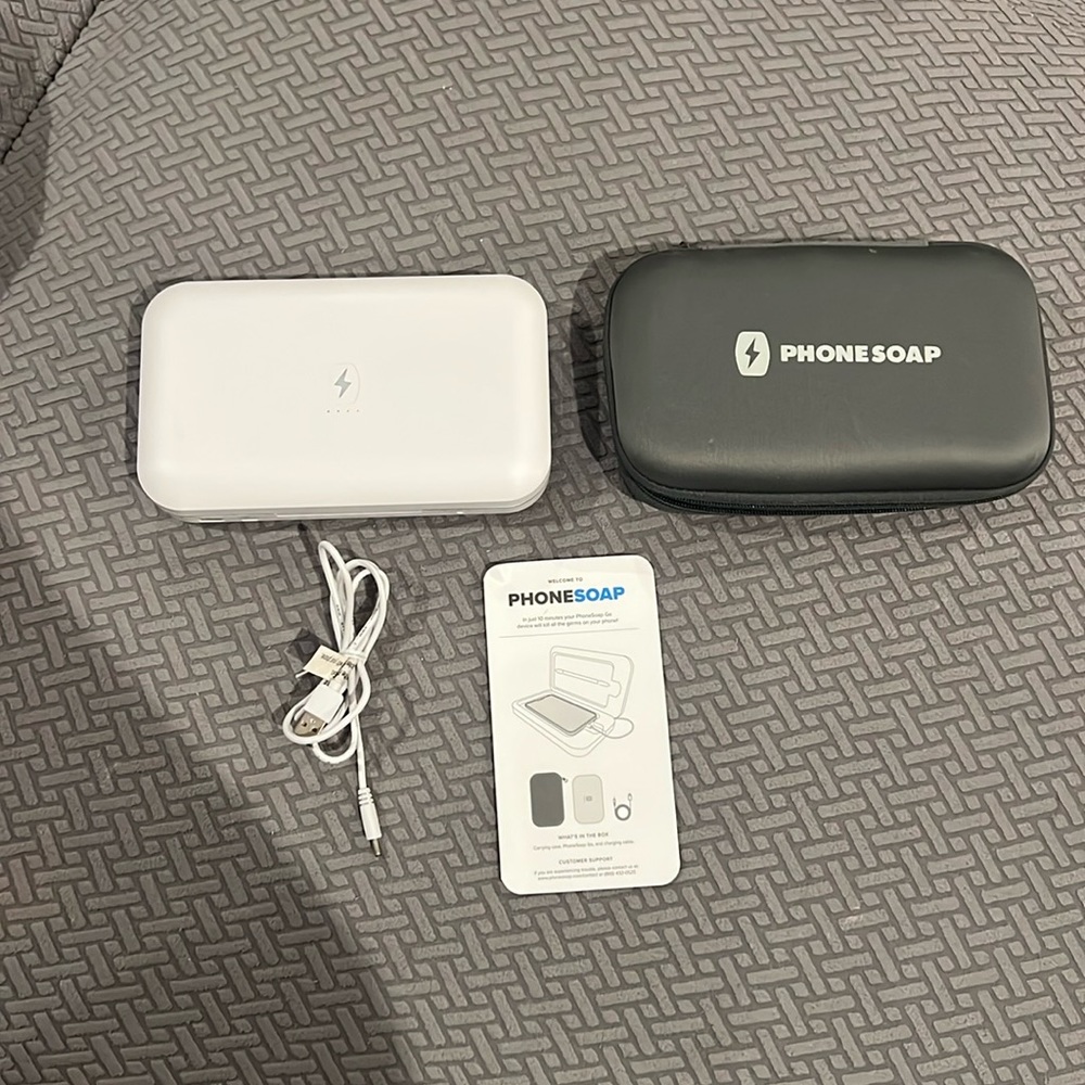 Like new Phone Soap Go Model 701-2 white comes with case and charger as seen